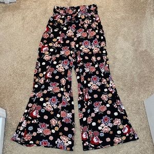Black w/ colorful Flower Flare-leg pants. Size medium. NWOT. Brand: Easel.